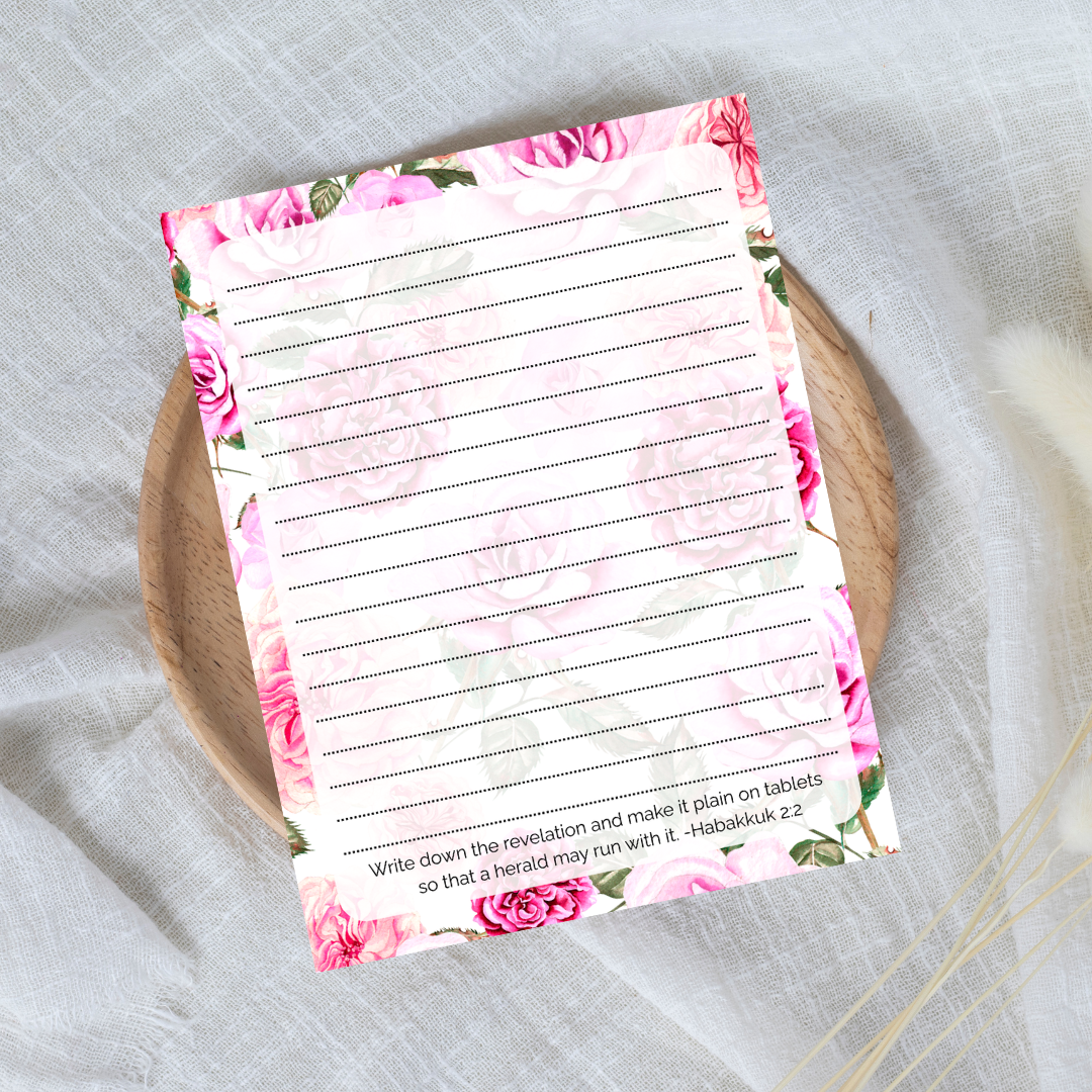Floral notepad with lined pages on a textured surface