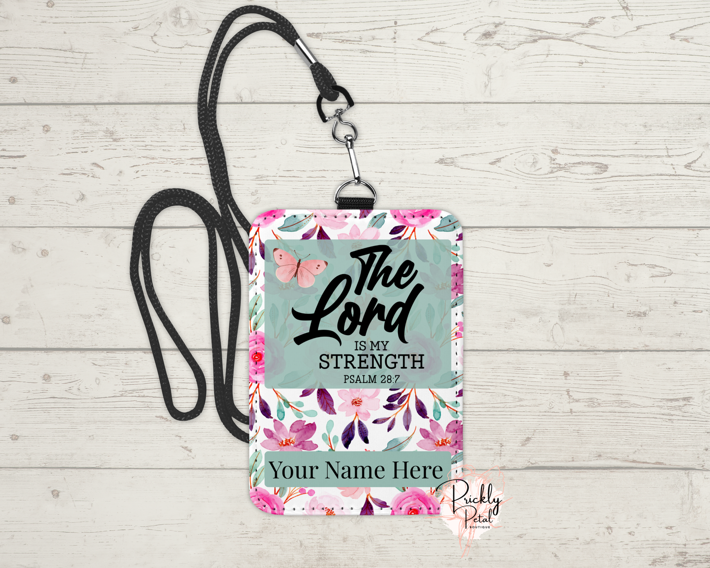 A daily reminder of strength and faith, beautifully carried with you. This floral badge holder features the encouraging words from Psalm 28:7: “The Lord is my strength.