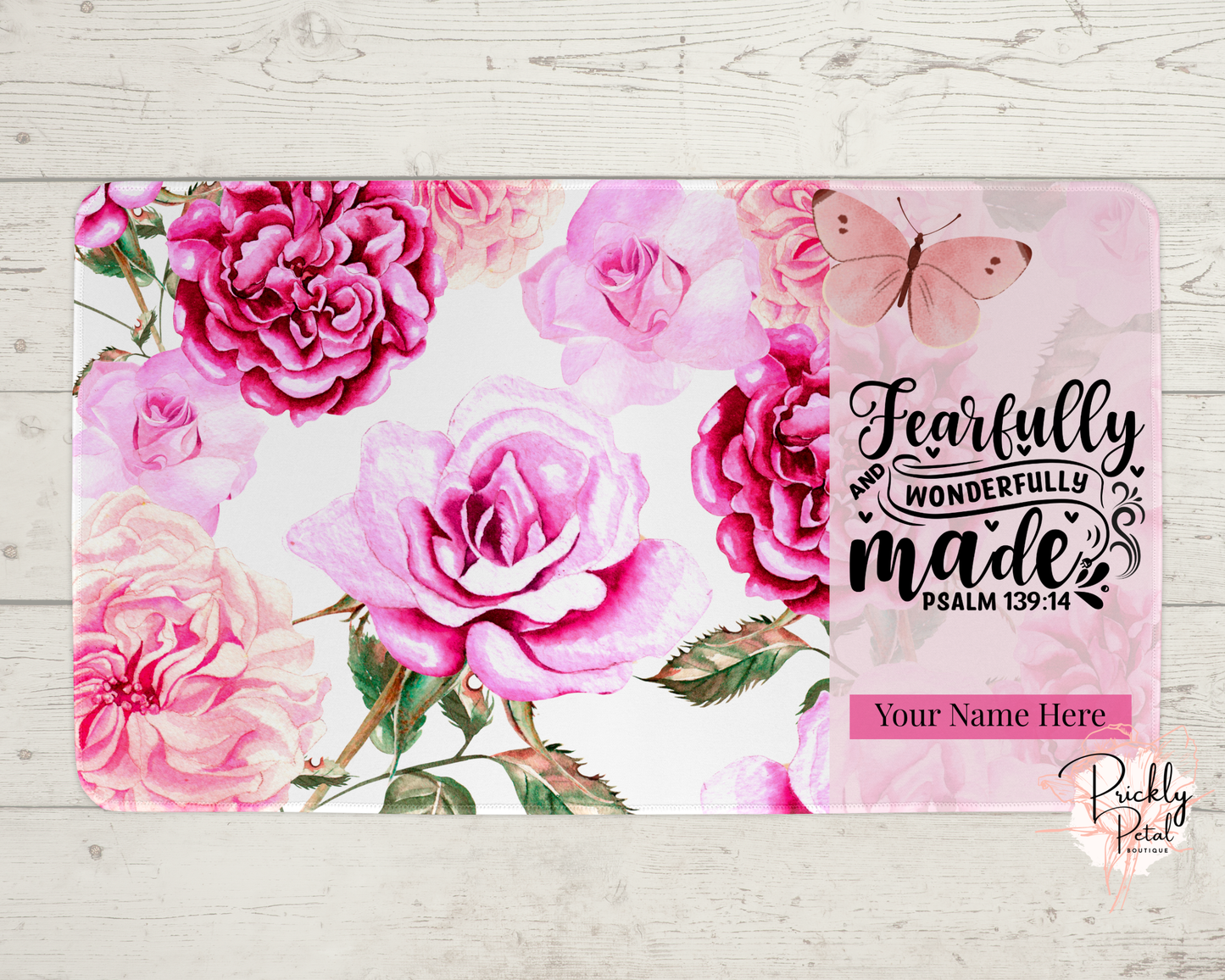 pink desk mat on wood background