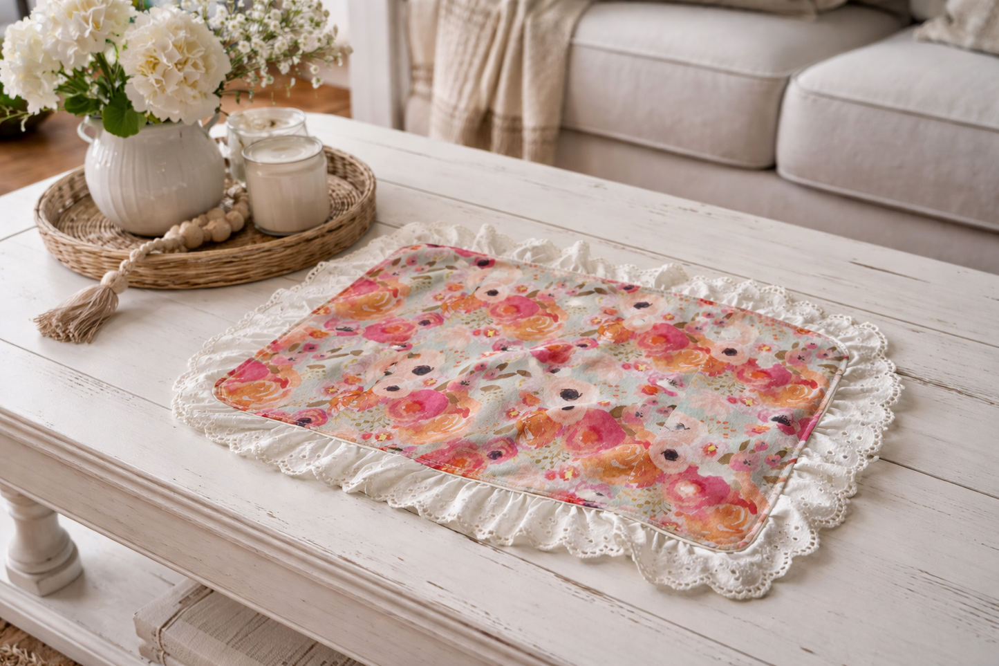 Floral bible cover on a wooden coffee table with decorative items.