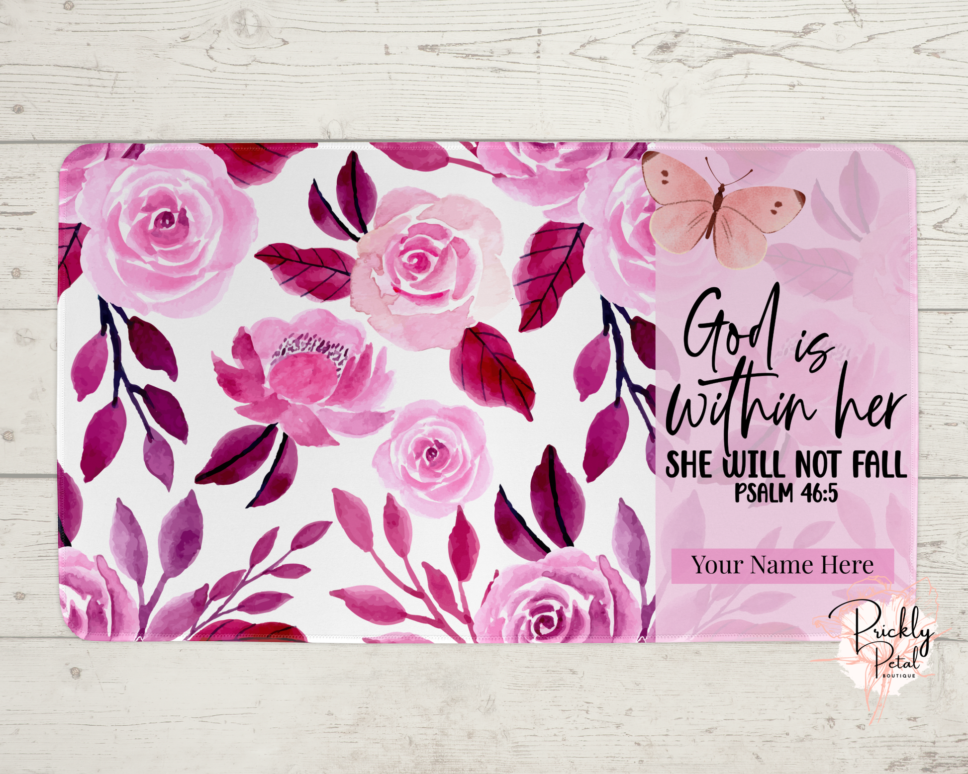 pink desk mat on wood background