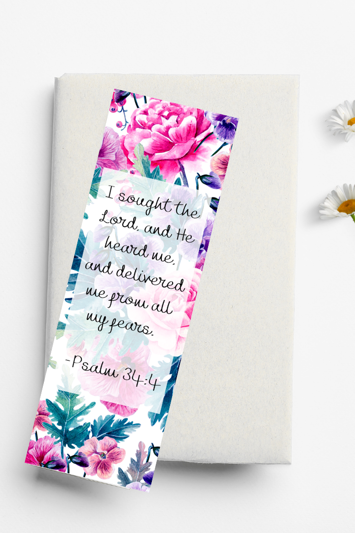Floral bookmark with inspirational text on a white background with daisies.