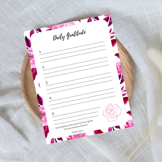 Daily Gratitude sheet with floral design on a textured surface