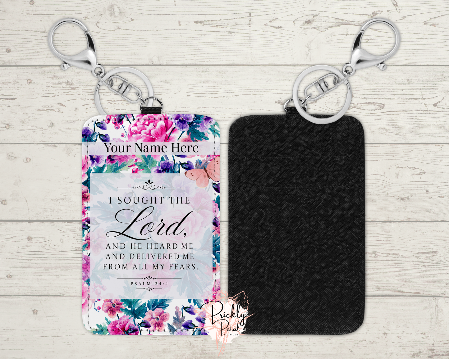 Floral keychain with engraved text on a wooden surface