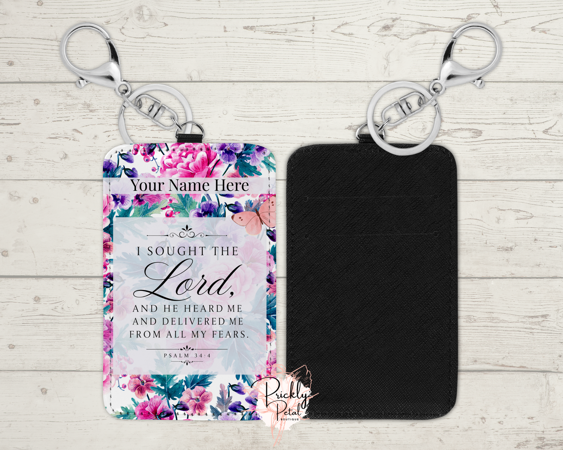 Floral keychain with engraved text on a wooden surface