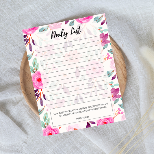 Floral daily list notepad on a textured surface