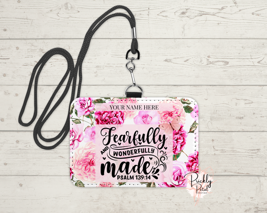 Floral design name tag with 'Fearfully and Wonderfully Made' text on a wooden background