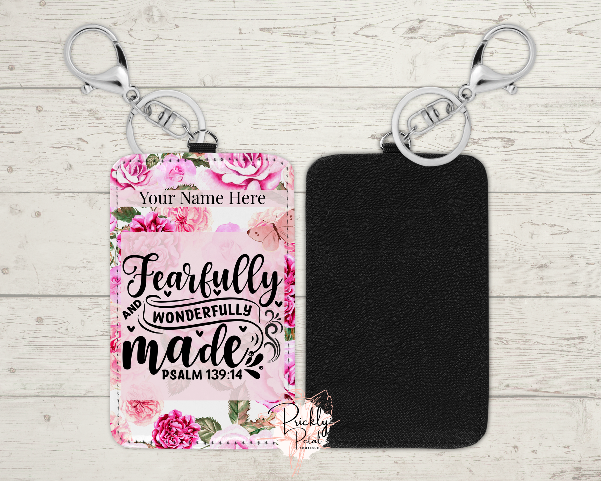 Floral keychain with 'Fearfully and Wonderfully Made' text on a wooden surface