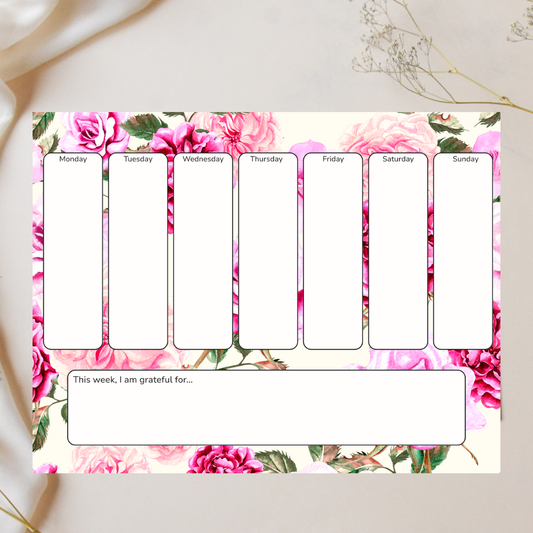 Weekly planner with floral design on a light background