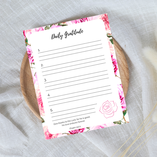 Daily Gratitude sheet with floral design on a textured surface