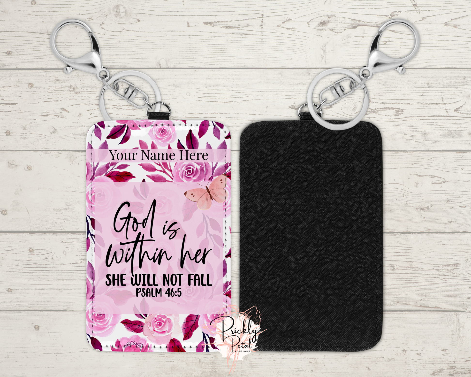 Keychain with floral design and motivational quote on a wooden surface