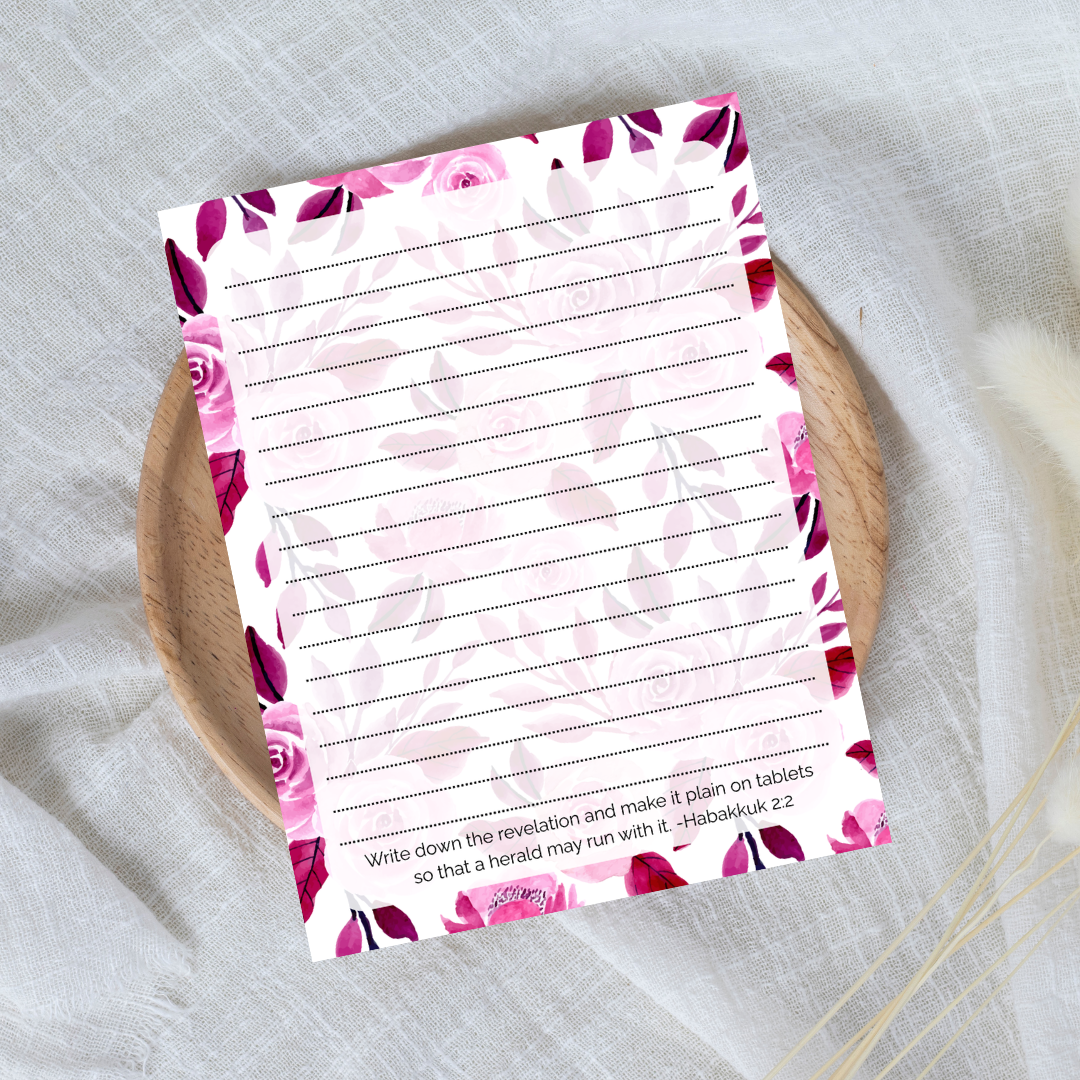 Floral notepad with lined pages on a textured surface
