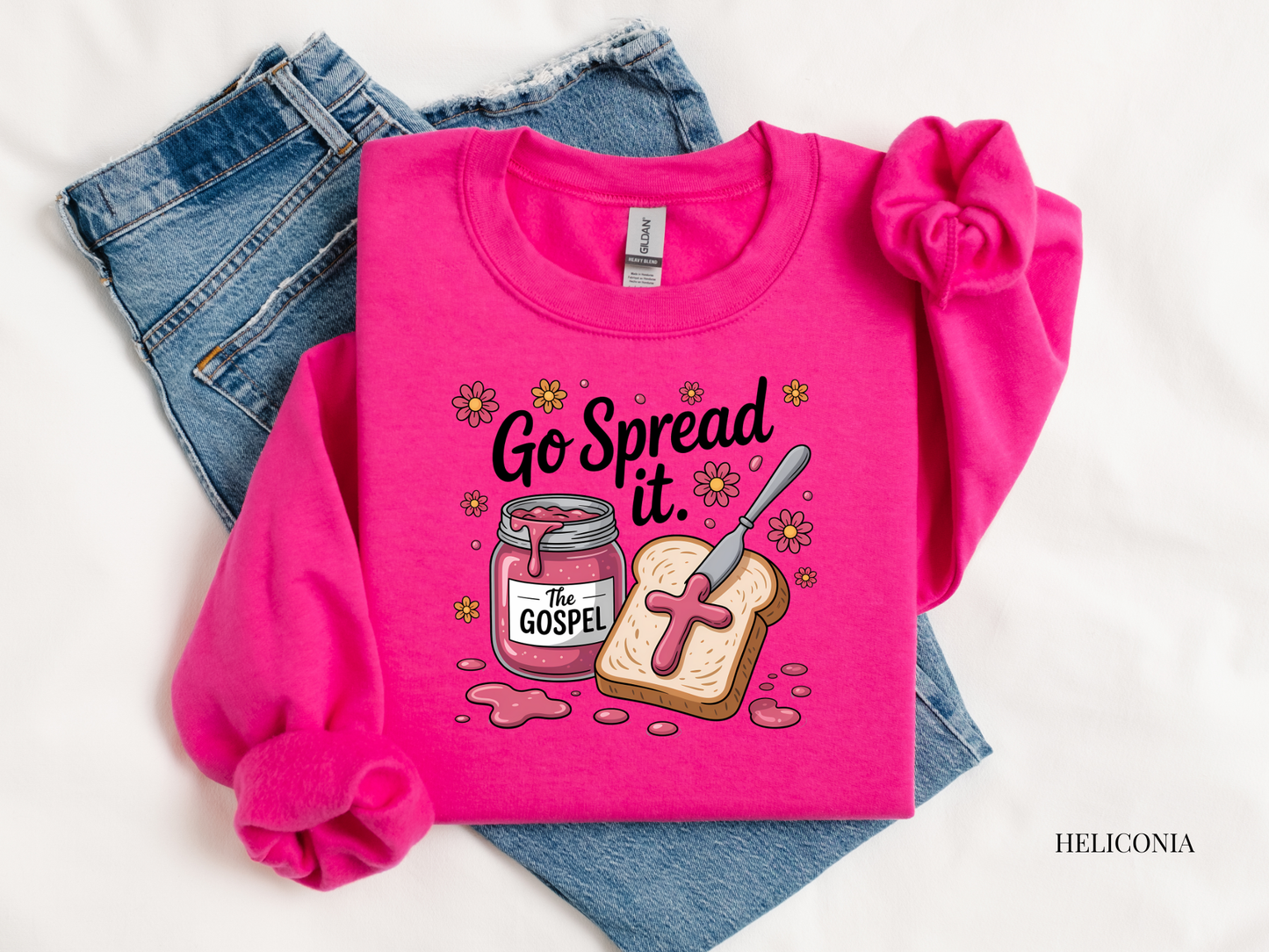 Pink sweatshirt with 'Go Spread It' design on a white background