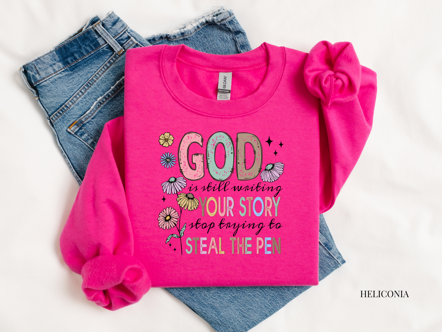 Pink sweatshirt with motivational quote on a white background
