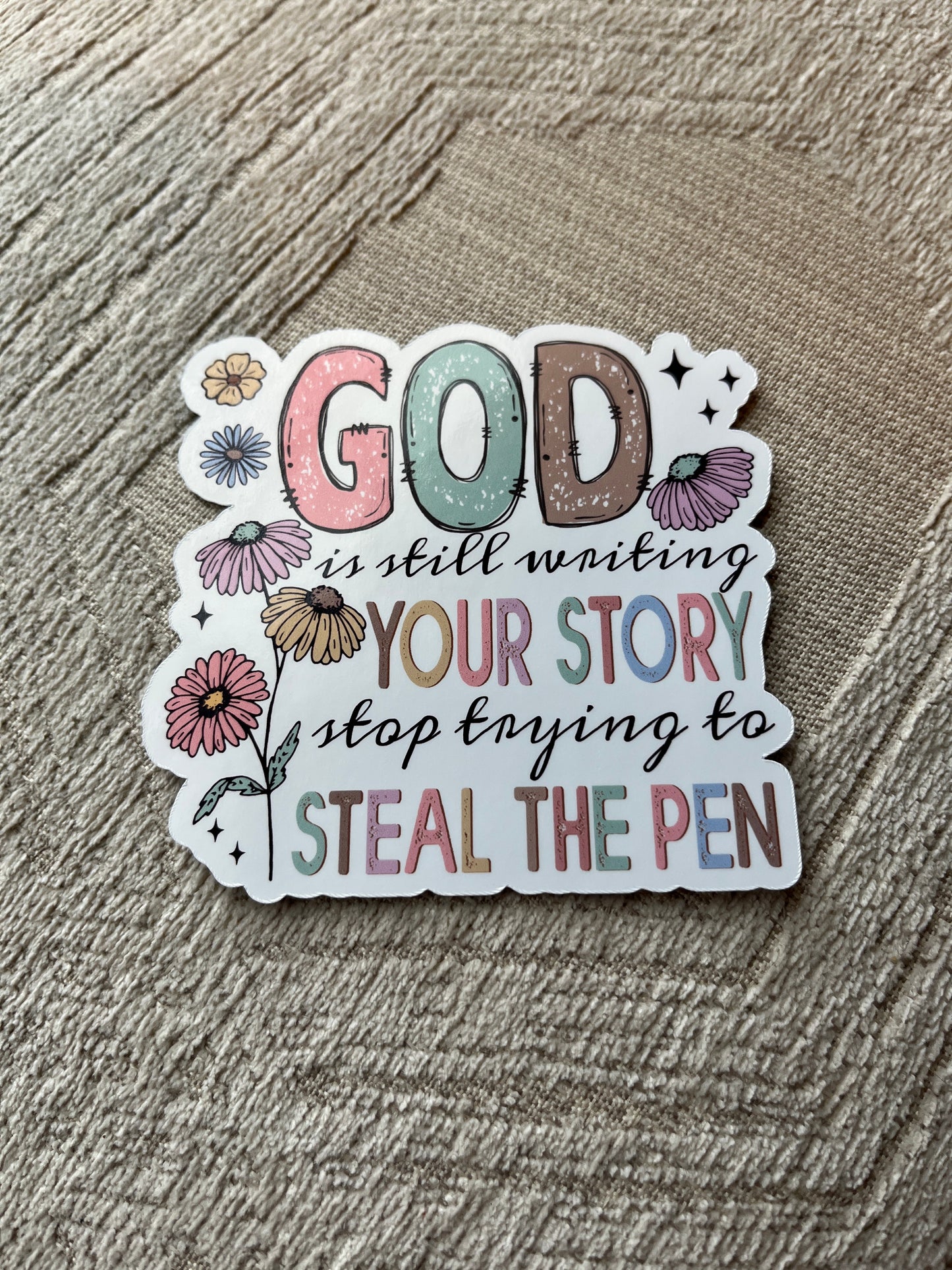 Decorative sticker with motivational text on a textured surface