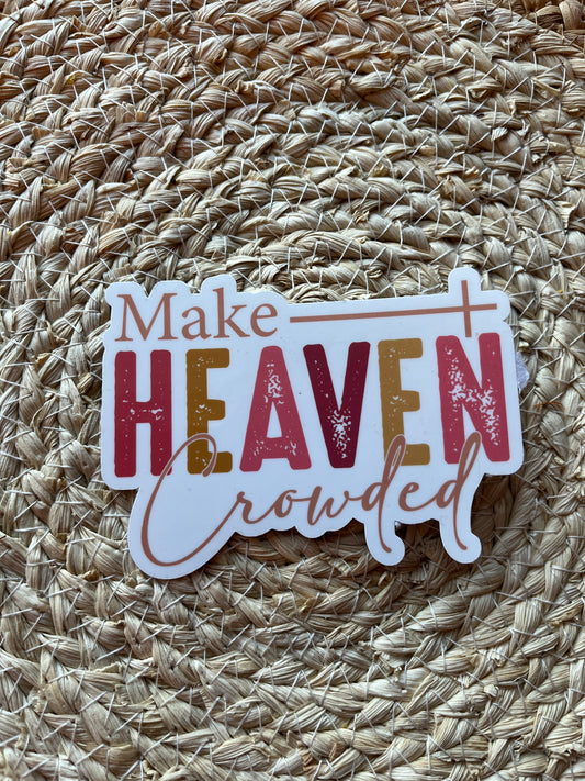 Sticker with 'Make Heaven crowded' text on a textured woven surface