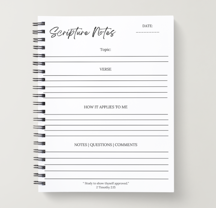 Notebook with pre-printed scripture notes layout on a gray background