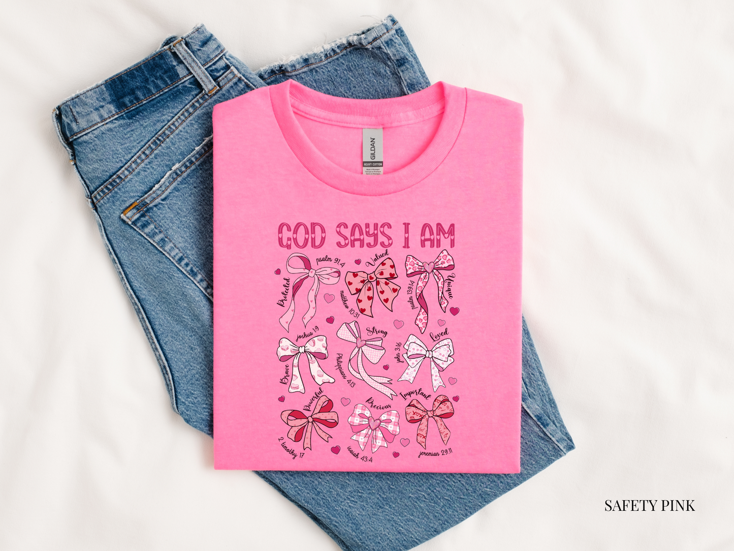 Pink t-shirt with graphic design and text on a white background